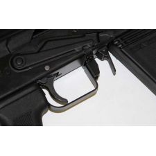 Close-up of Saiga 12 trigger guard and selector stop, black finish, installed on receiver.