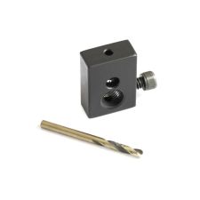 Angled view of dark heat-treated steel gas piston drilling jig, TiN drill bit.