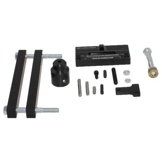 AK-Builder Barrel Press Kit components: black oxided rams, brass block, and trunnion blocks.