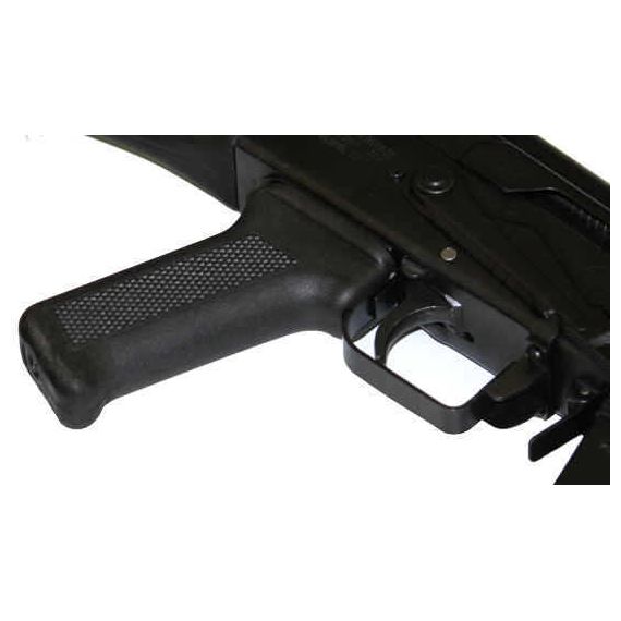 Angled close-up of AK-Builder Saiga 12 trigger guard and black textured pistol grip installed.