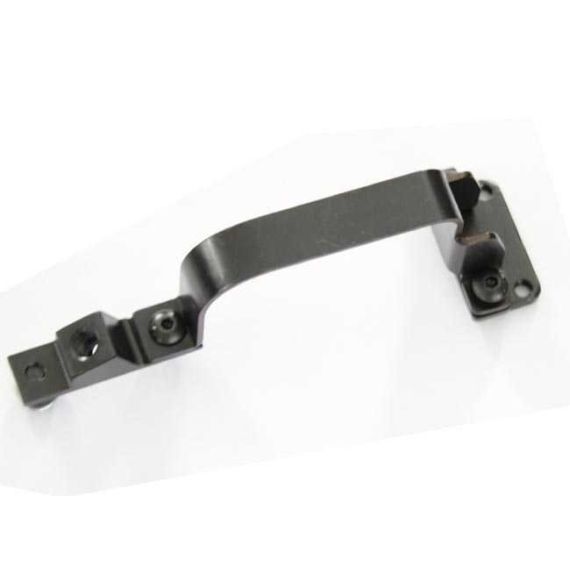 Angled view of AK-Builder Saiga 12 trigger guard component, dark finished steel with rivet/screw holes.