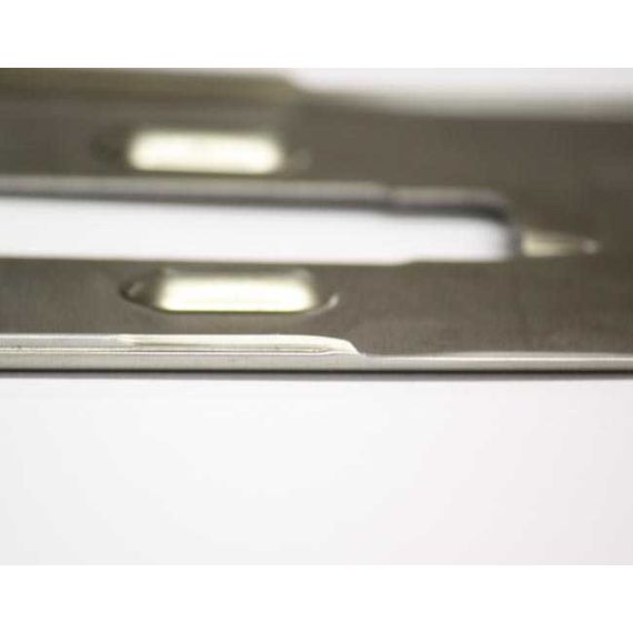 Close-up of AK-Builder Polish Underfolder 1mm receiver flat, 4130 annealed steel, in the white.