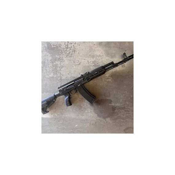 AKM rifle side view with matte black anodized TDi AK dust cover and Picatinny rail.