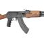 Side view of Hogue AK-47/AK-74 rubber grip with finger grooves installed on black AK receiver.