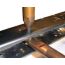 Close-up of AK-Builder Spot Welder Tong with screw-on tip welding an AK receiver rail.